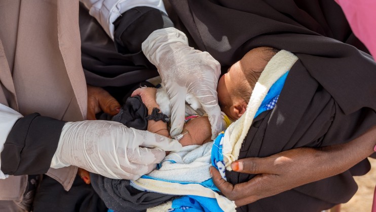 A 5 day old child being given the BCG and OPO vaccine at the Dalow Mobile Clinic. The child was accompanied by her mother A